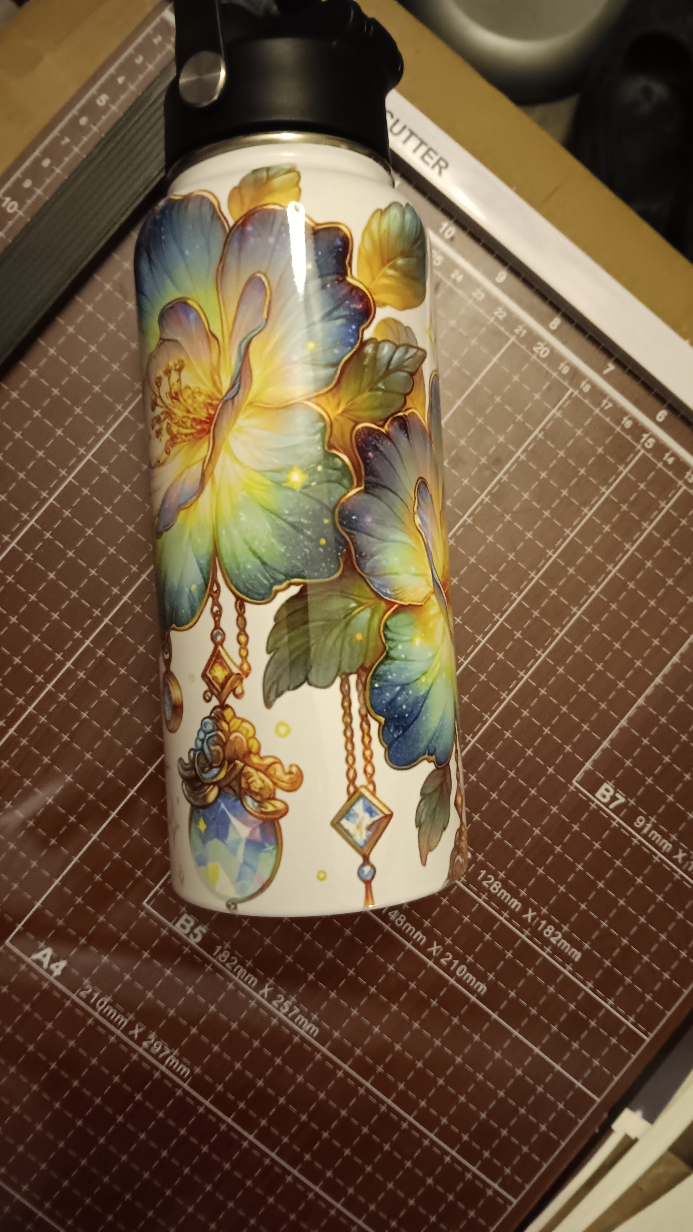32 oz Flower tumbler with a handle, pour spout, and closing straw