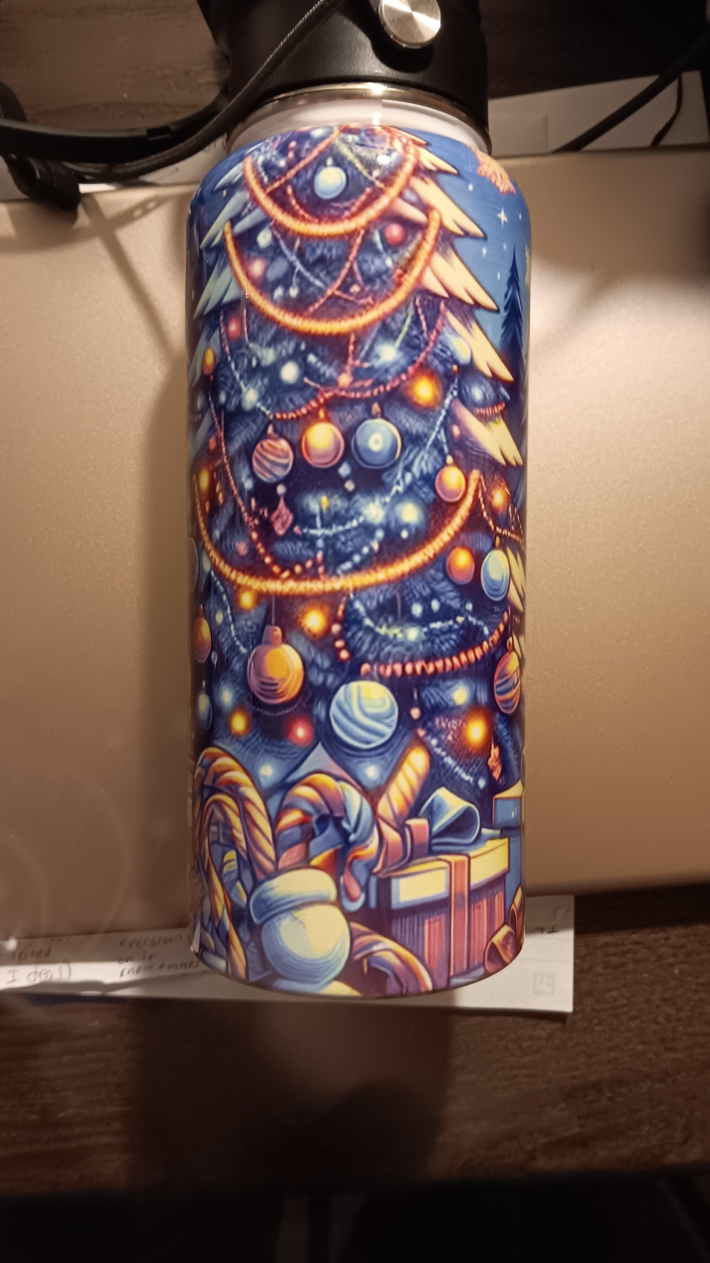 32 oz christmas themed Hydro Tumbler with a handle, pour spout, and closing straw.
