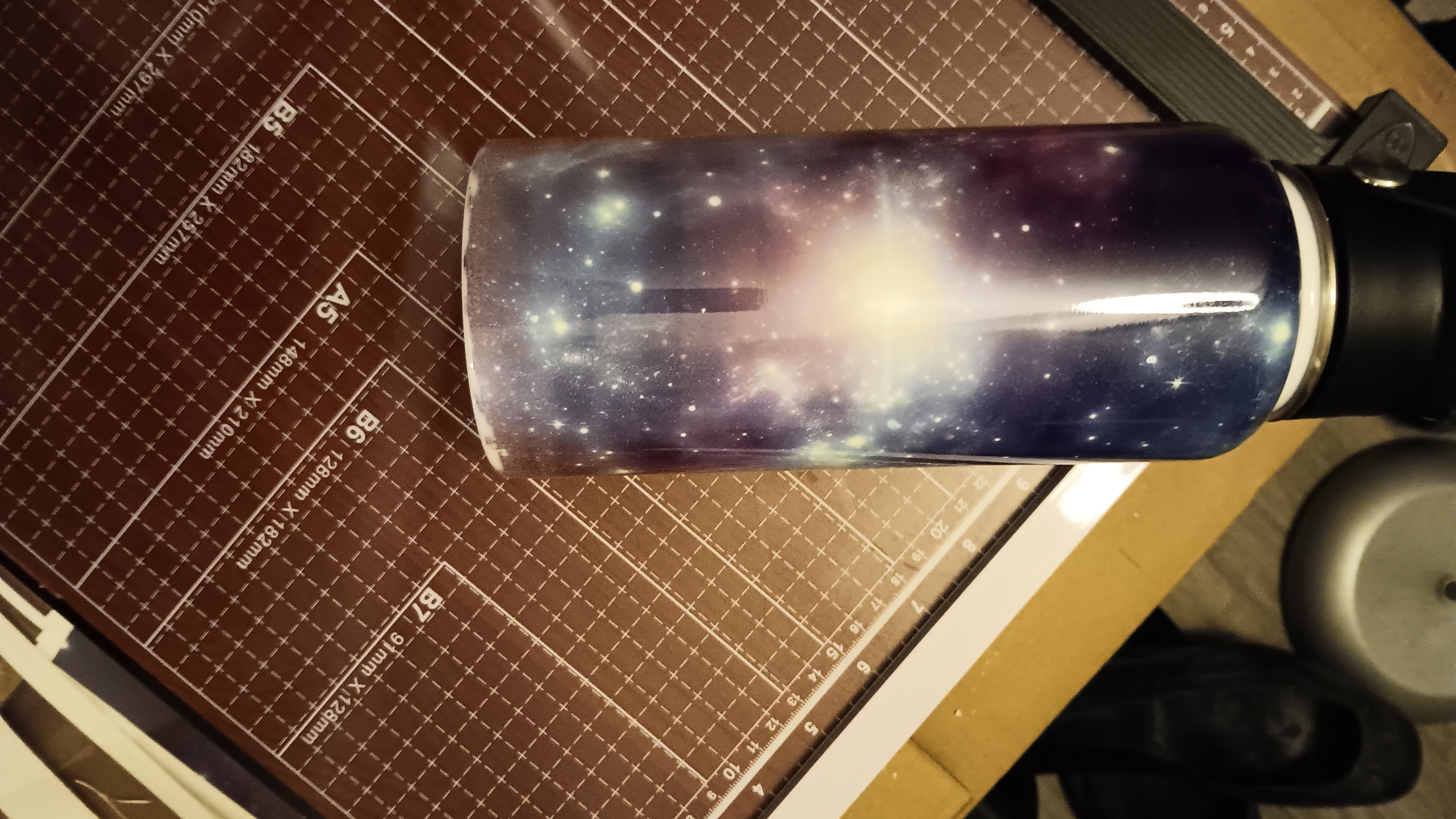 32 oz galaxy themed Hydro Tumbler with handle, pour spout, and closing straw.