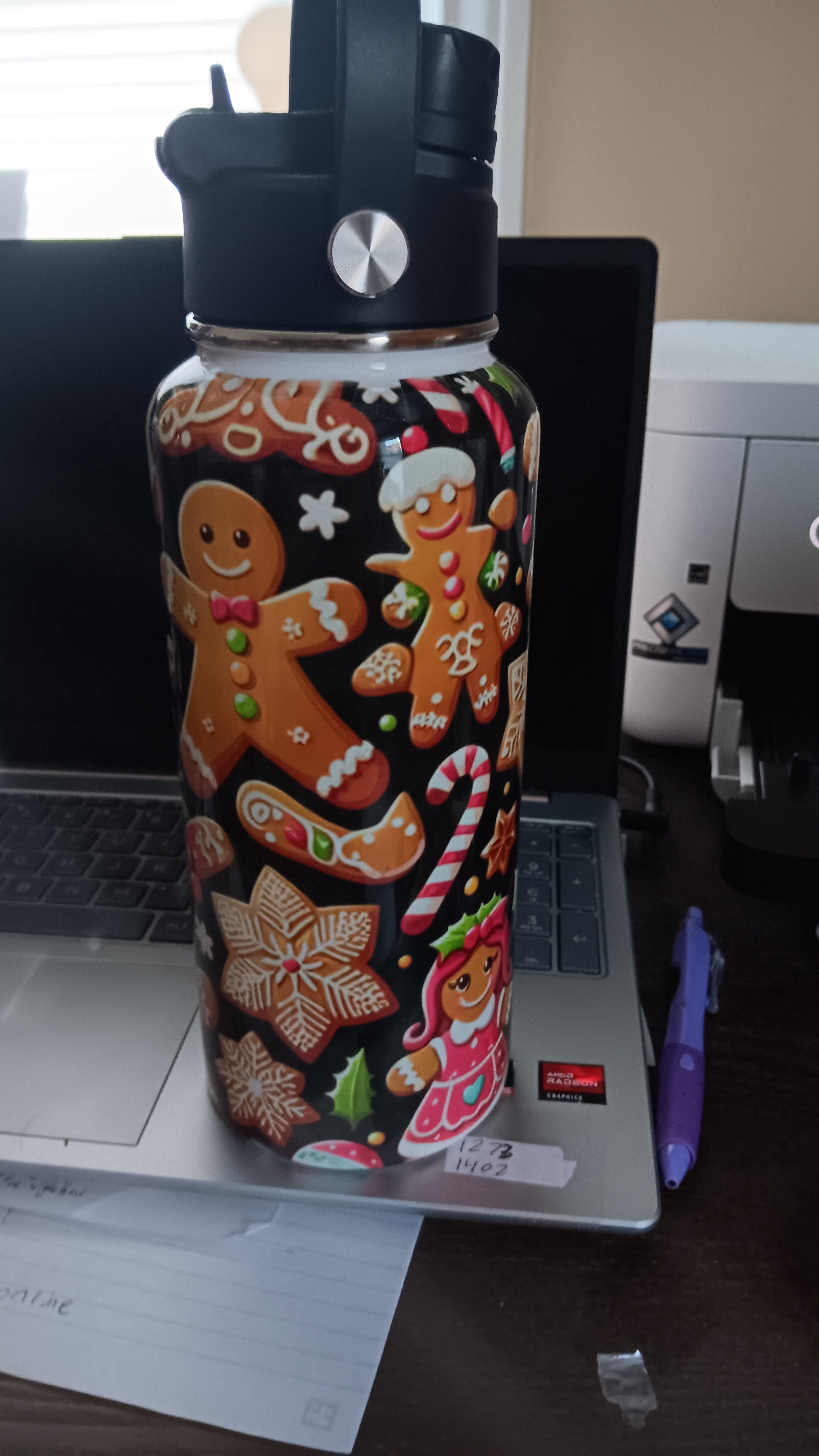 32 oz christmas themed hydro tumbler with a handle, pour spout, and closing straw.