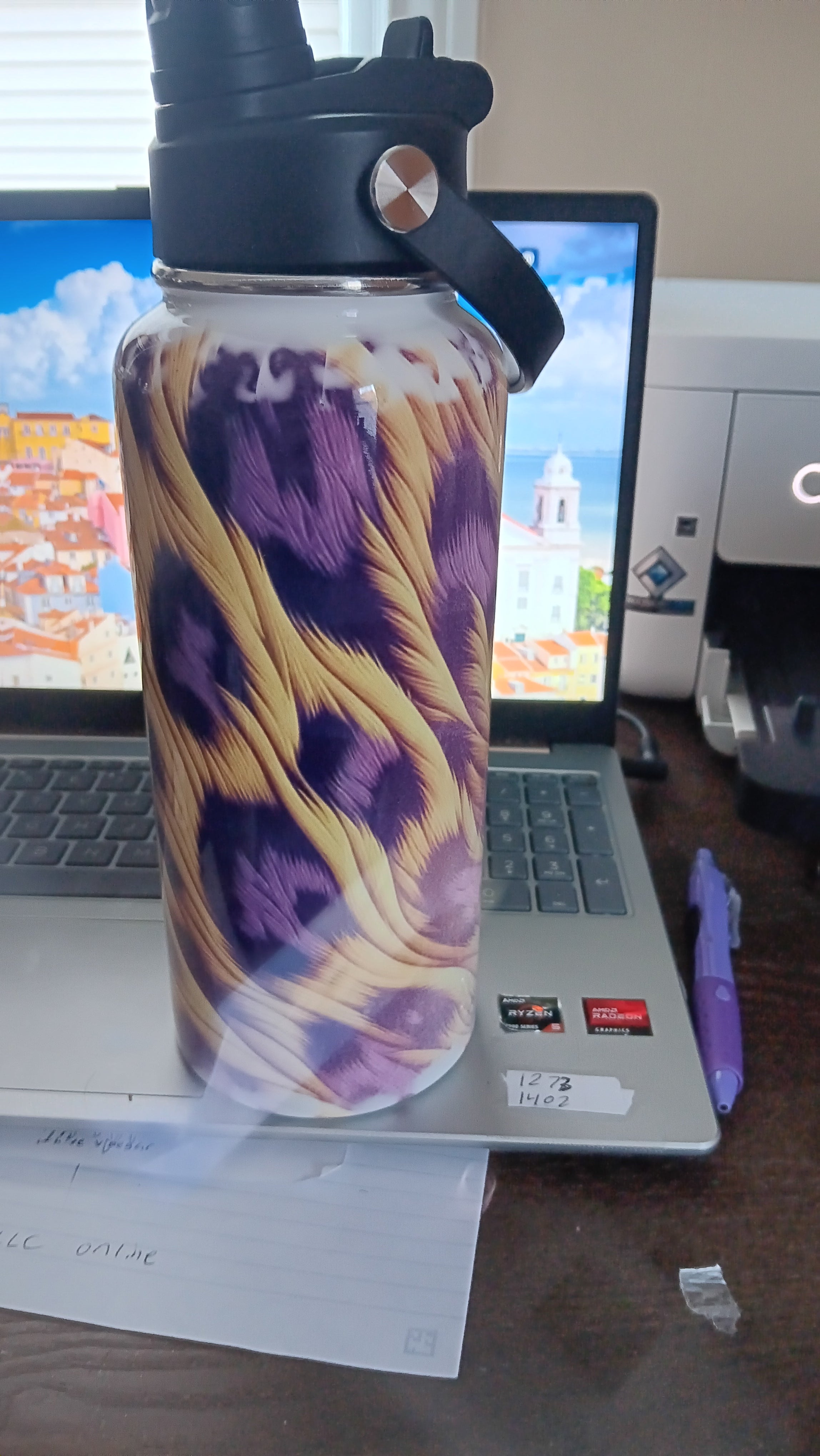 32 oz leopard print Hydro Tumbler with a handle, pour spout, and closing straw